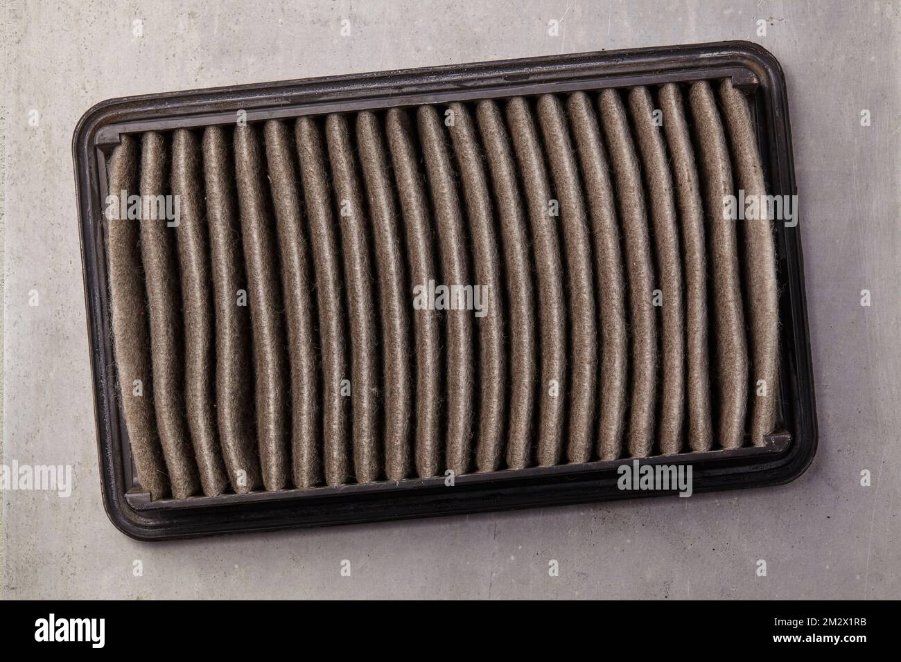 used air filter that must be replaced in the context of car maintenance Stock Photo