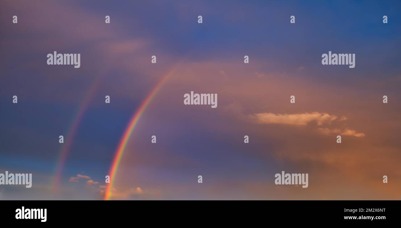 double-rainbow-in-an-atmospheric-sky-with-few-cirrocumulus