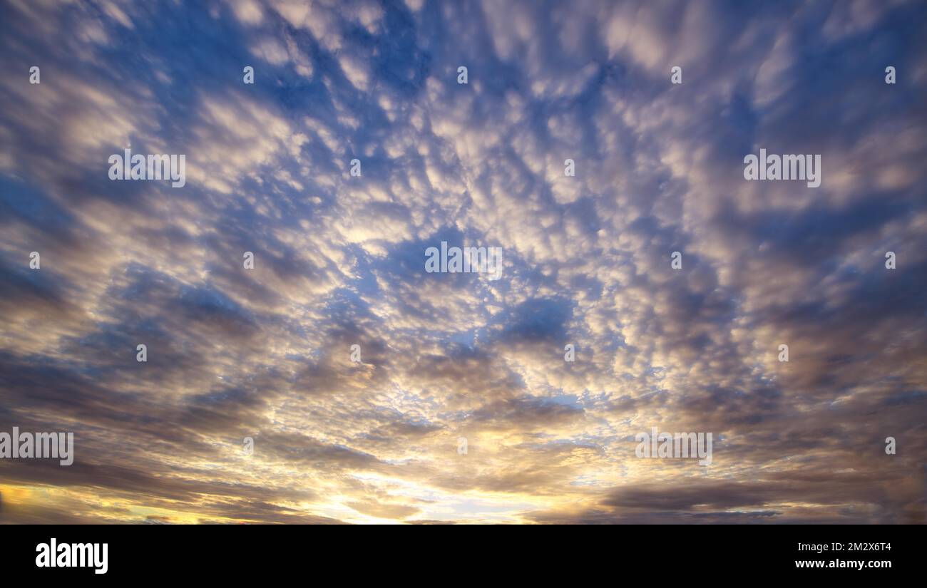 Atmospheric stratocumulus cloud (Stratocumulus) at sunset Stock Photo