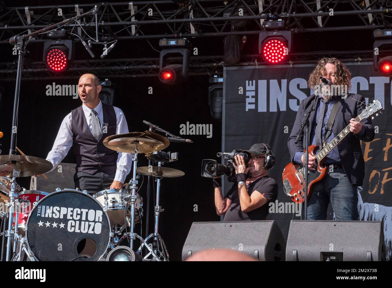 The singer / guitarist and the drummer of the rock band Inspector Cluzo on stage Stock Photo