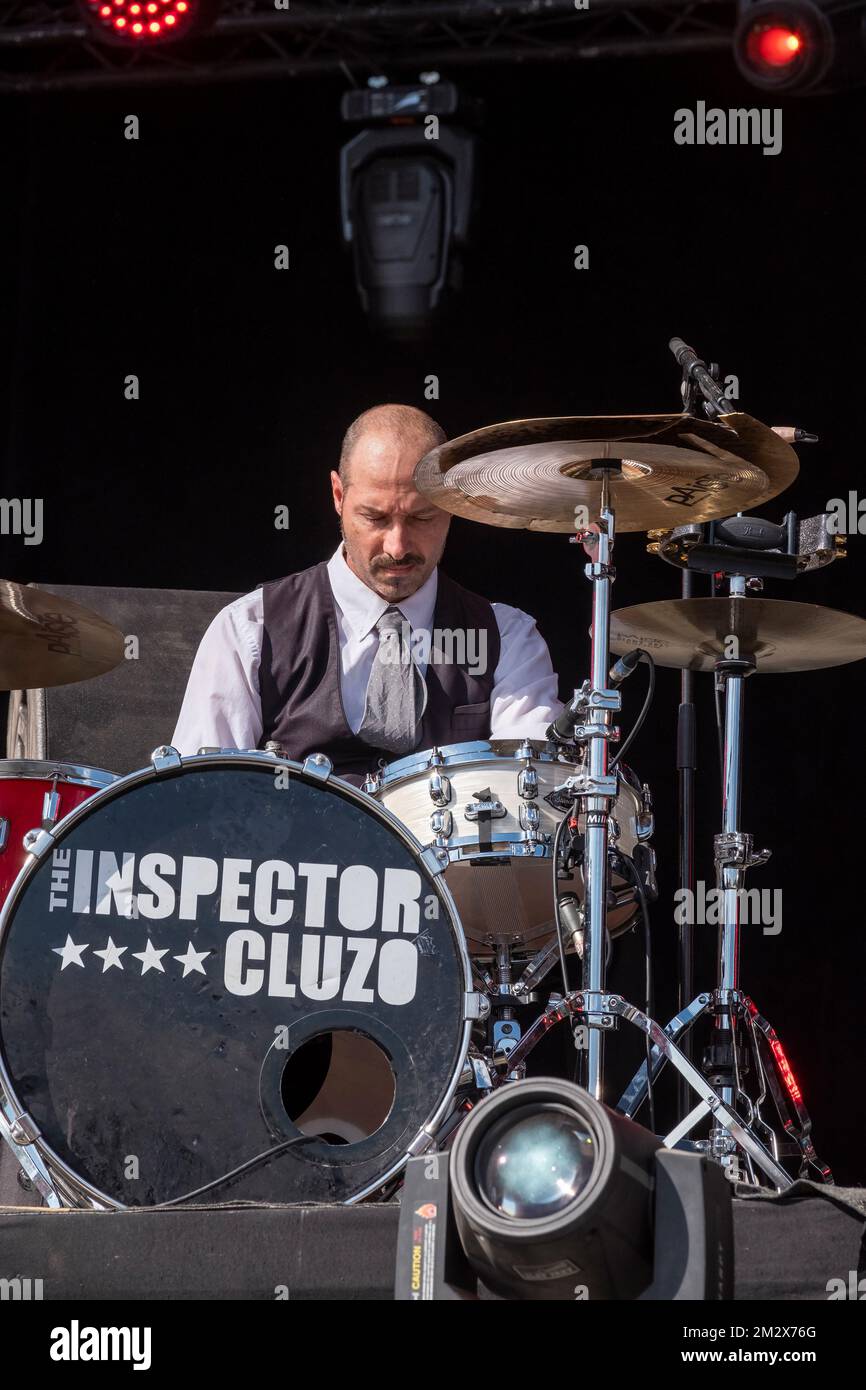 The drummer of the rock band Inspector Cluzo focused on his playing Stock Photo