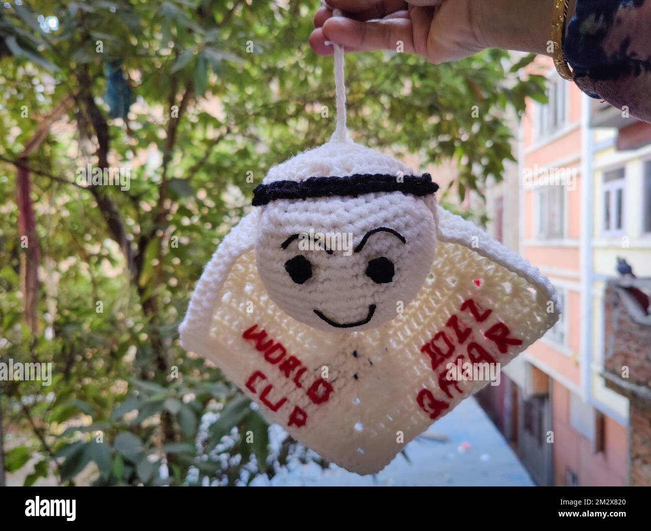 Kathmandu, Bagmati, Nepal. 14th Dec, 2022. A Nepali woman shows the crocheted Qatar World Cup mascot ''La'eeb'' in Kathmandu, Nepal on December 14, 2022. (Credit Image: © Sunil Sharma/ZUMA Press Wire) Stock Photo