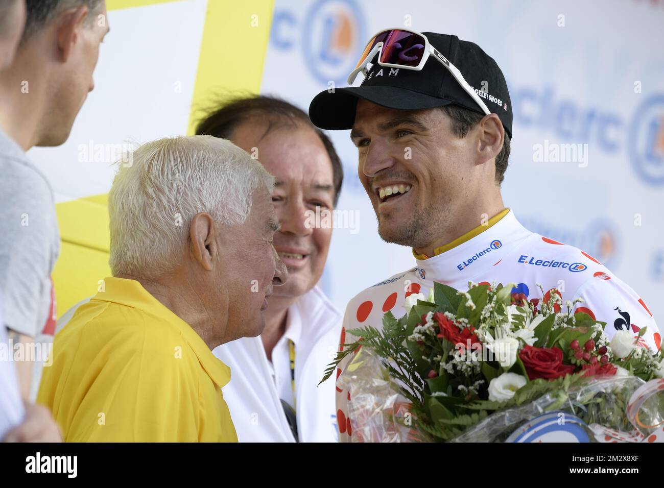 Former cyclist Raymond Poulidor and Belgian Wout Van Aert of Team  Jumbo-Visma on the podium of the second stage of the 106th edition of the  Tour de France cycling race, a 27,6km