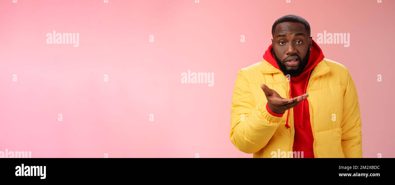Bothered rude ignorant african-american bearded man pointing palm ...