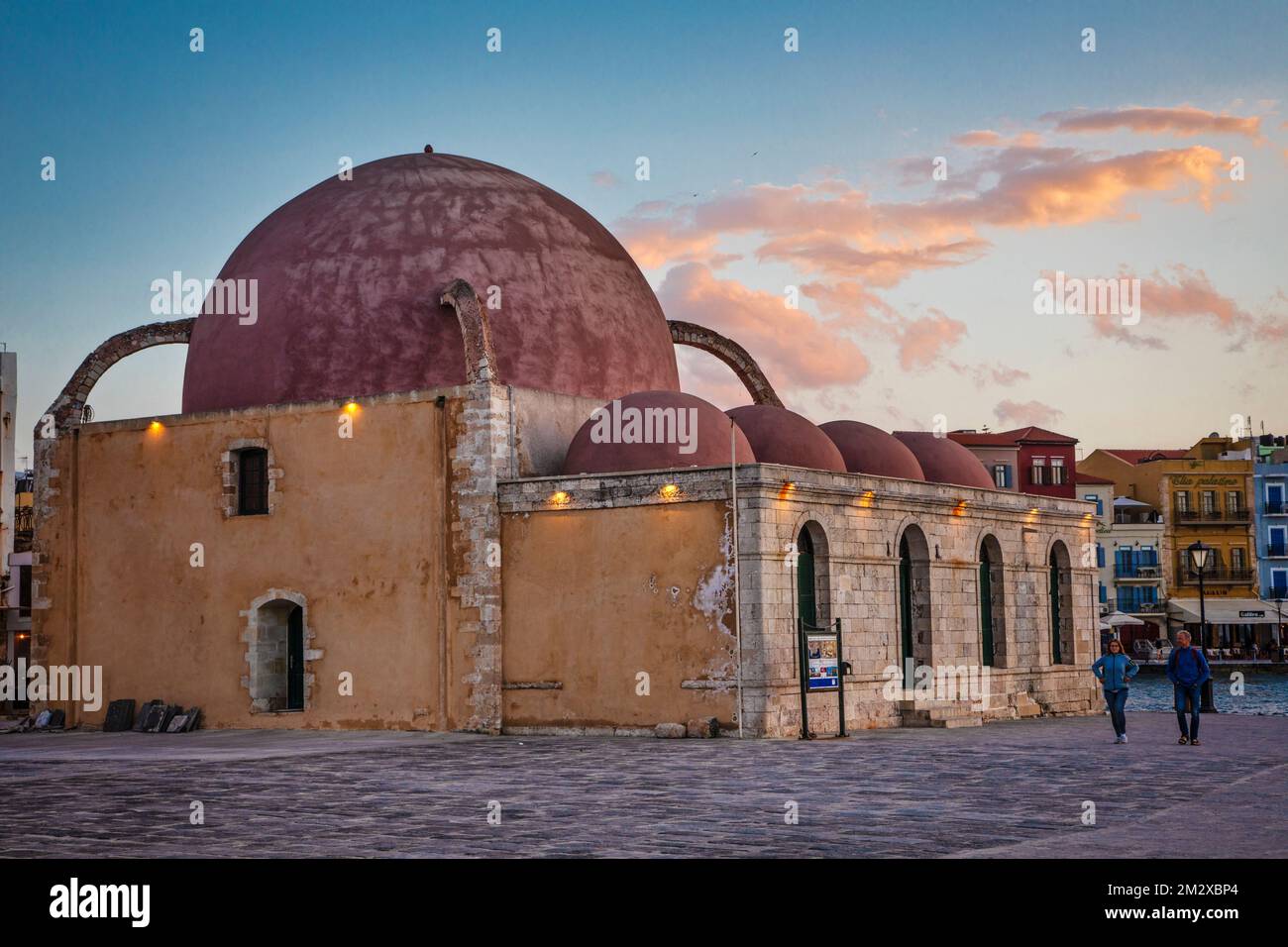 The Turkish Mosque Yiali Tzami (or Giali Tzami) sits on the harbor in Chania, Greece. Stock Photo
