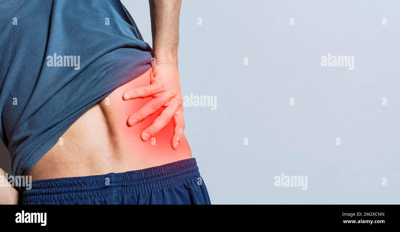 Man with spine and lower back problems, people with lower back pain isolated, lumbar problems concept, a sore man with back pain. Unrecognizable Stock Photo