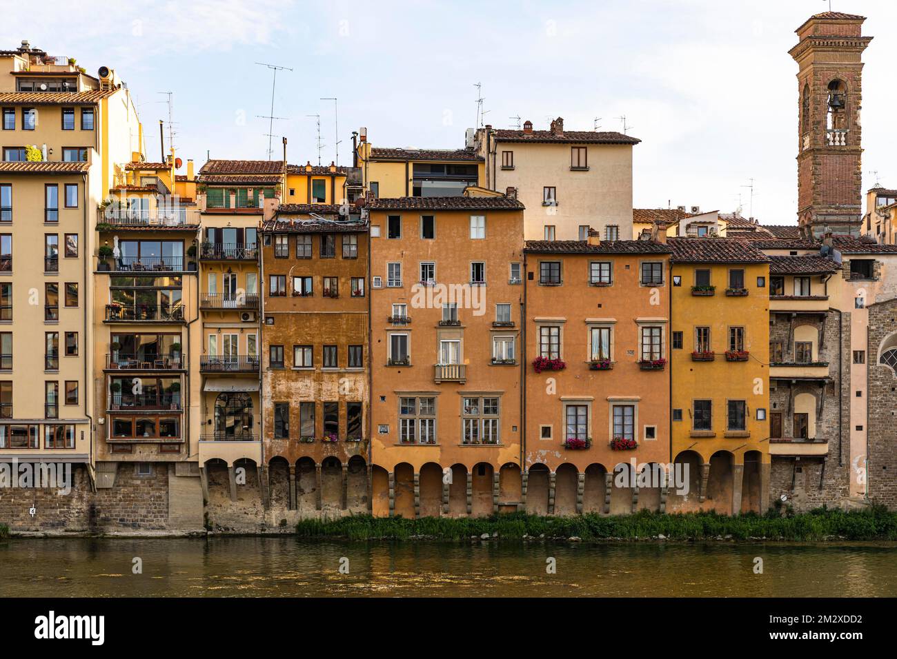 Houses in pastel-coloured facades on the banks of the Arno, Florence ...