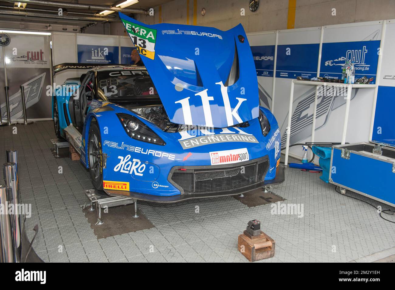 Corvette C7 GT3R stands with open for maintenance adjustment on