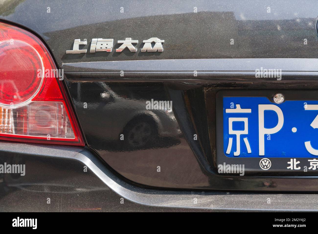 Rear with numberplate and model written in Chinese characters / writing VW Volkswagen car / vehicle in China.  Xian, China. (125) Stock Photo