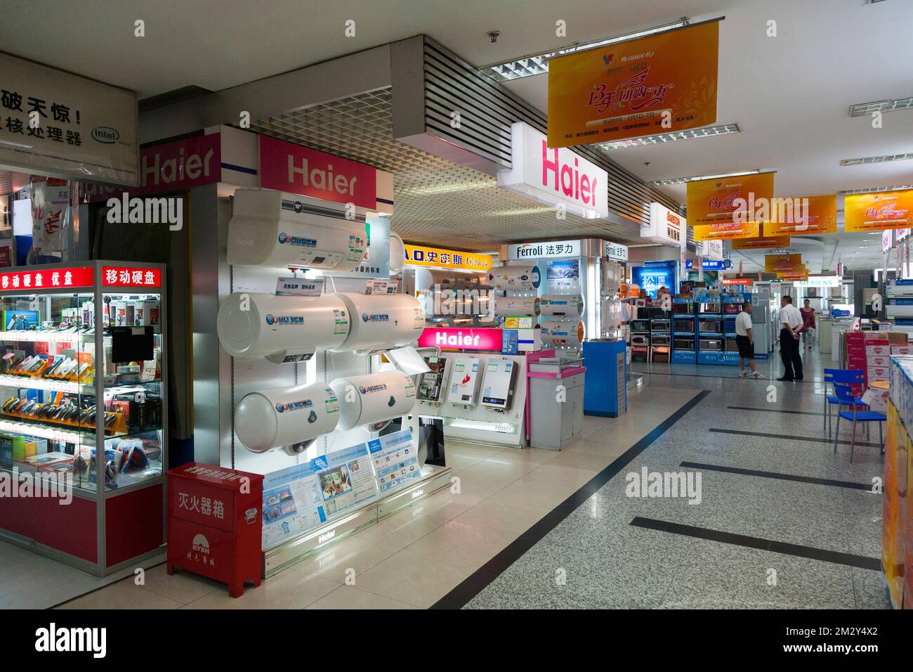 View inside a modern retail shopping mall with various concessions including electrical shop / store such as Haier. Xian, China. PRC (125) Stock Photo