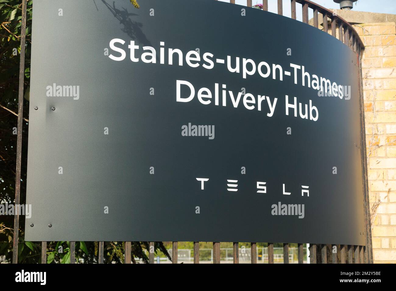 Delivery collection hub sign / signage / signs for UK customers picking up a new Tesla EV electric vehicle car manufactured and operated by Tesla Inc of the USA. Located in Staines upon Thames. (132) Stock Photo