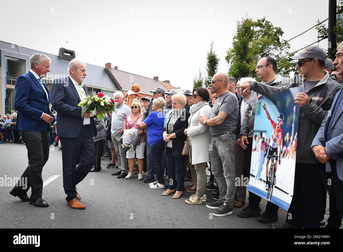 Aalter mayor Pieter De Crem and Binckbank Tour organiser Rob Discart lay down flowers in Knesselare in remembrance of late Belgian cyclist Bjorg Lambrecht of Lotto Soudal, who died on August 5th after a crash during the Tour of Poland, at the third stage of the Binckbank Tour cycling race, from and to Aalter (166,9 km), Wednesday 14 August 2019. BELGA PHOTO DAVID STOCKMAN Stock Photo