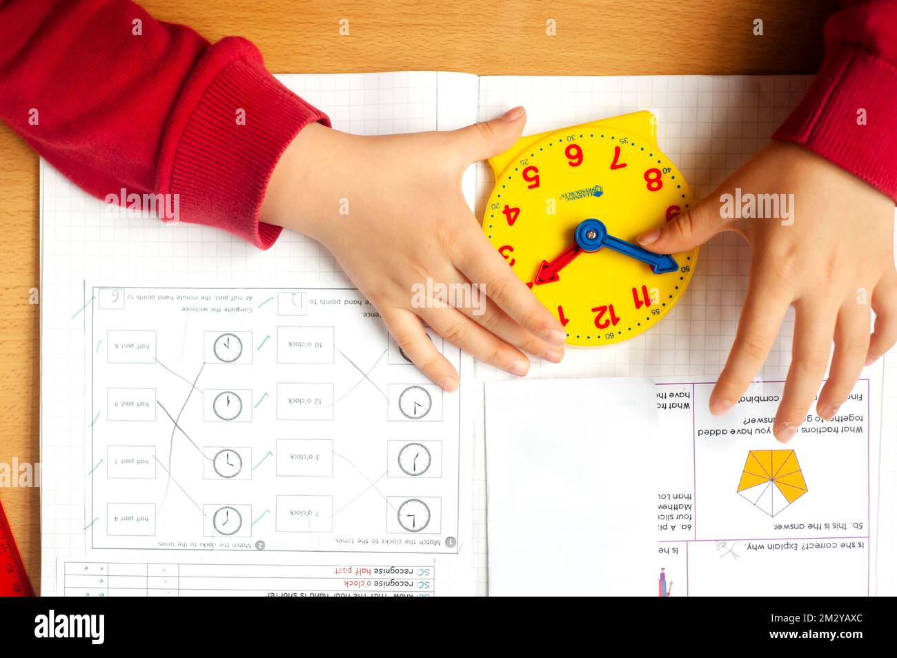 Child using teaching clock hires stock photography and images Alamy