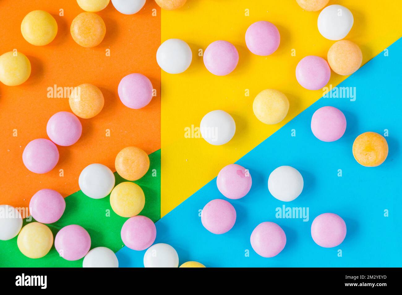 Candy on the colorful background, high angle view, circle candies Stock