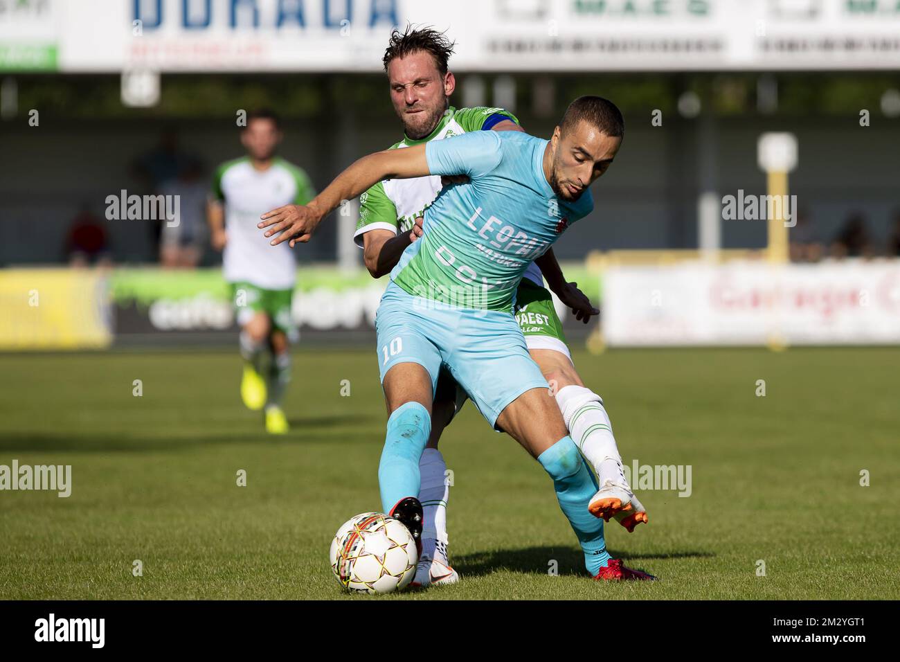 Dessel's Kevin Janssens and Virton's Mehdi Lazaar fight for the ball during a soccer game between Dessel Sport (First amateur division) and Royal Excelsior Virton (1b 2nd division), Saturday 24 August 2019 in Dessel, in the fifth round of the 'Croky Cup' Belgian cup. BELGA PHOTO KRISTOF VAN ACCOM Stock Photo