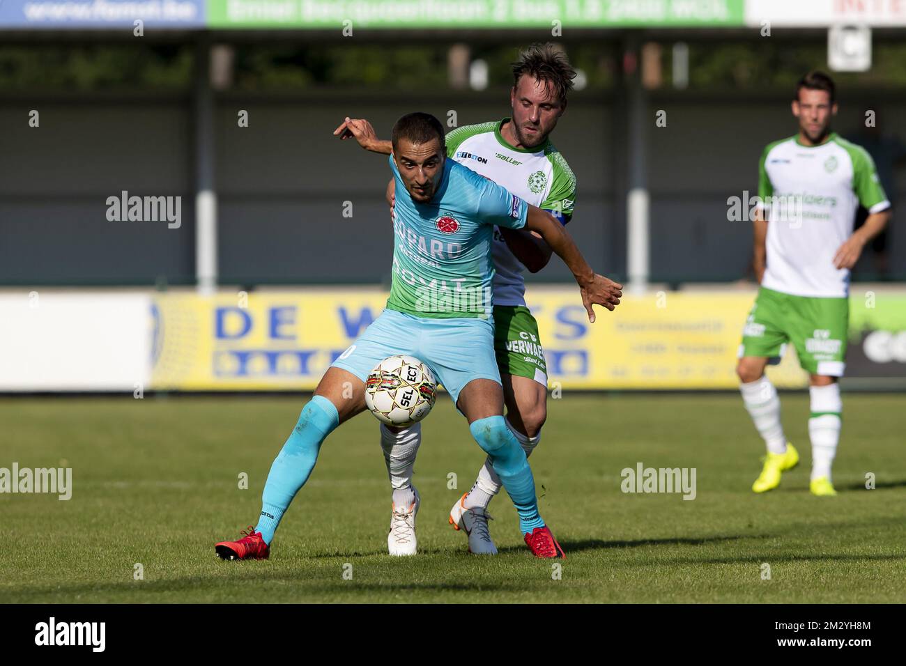 Virton's Mehdi Lazaar and Dessel's Kevin Janssens fight for the ball during a soccer game between Dessel Sport (First amateur division) and Royal Excelsior Virton (1b 2nd division), Saturday 24 August 2019 in Dessel, in the fifth round of the 'Croky Cup' Belgian cup. BELGA PHOTO KRISTOF VAN ACCOM Stock Photo