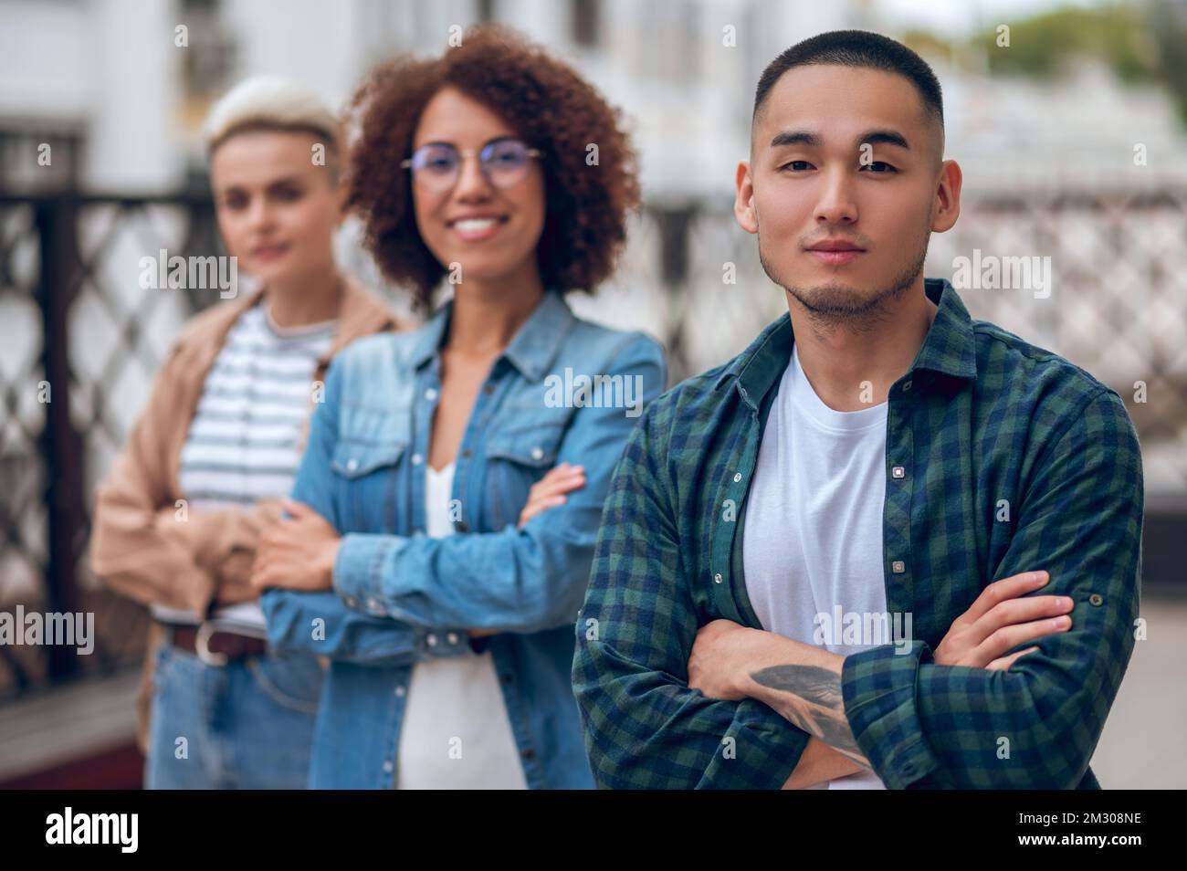 Guy in the company of ladies on the veranda Stock Photo