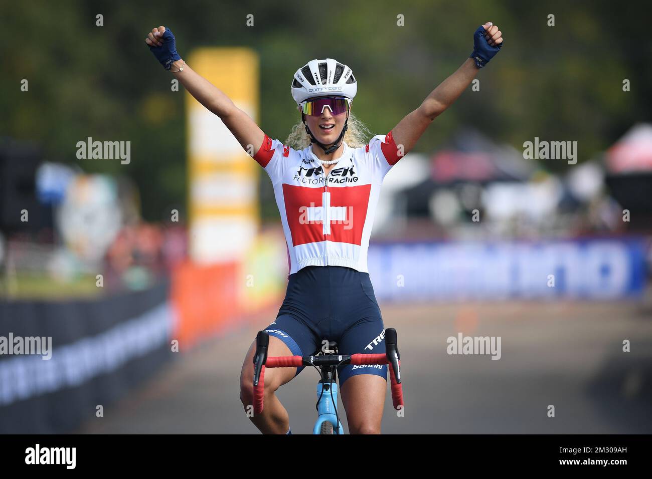 Swiss Jolanda Neff celebrates as she crosses the finish line to win the