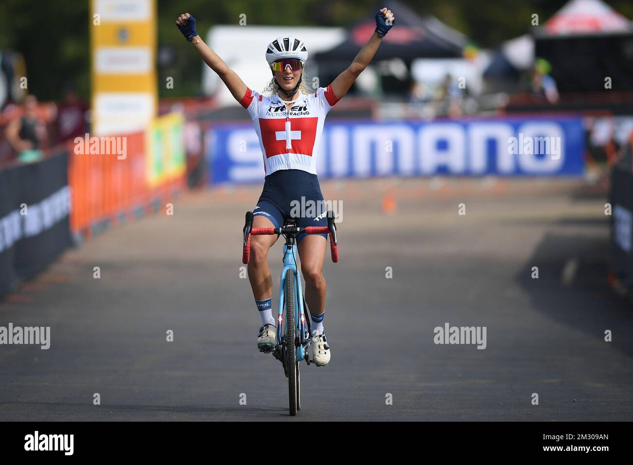 Swiss Jolanda Neff celebrates as she crosses the finish line to win the