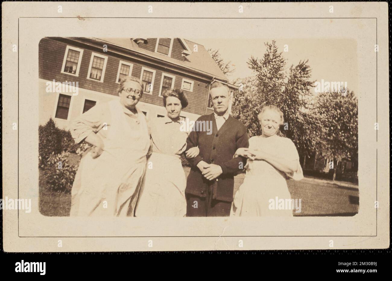 Four People in Front of House ,. Messenger Collection Stock Photo - Alamy