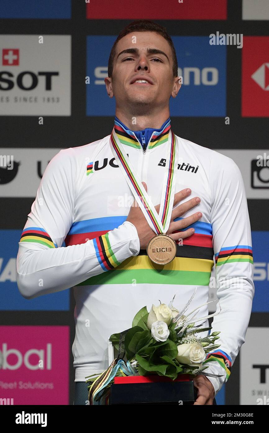Italian Samuele Battistella celebrates on the podium after winning the