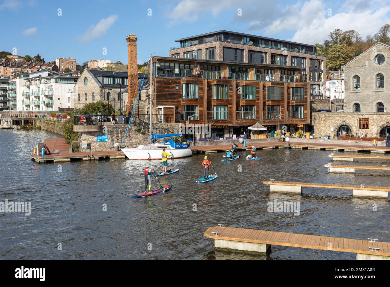 Group of stand up paddleboarders in Bristol's Floating Harbour, Bristol Harbourside, City of