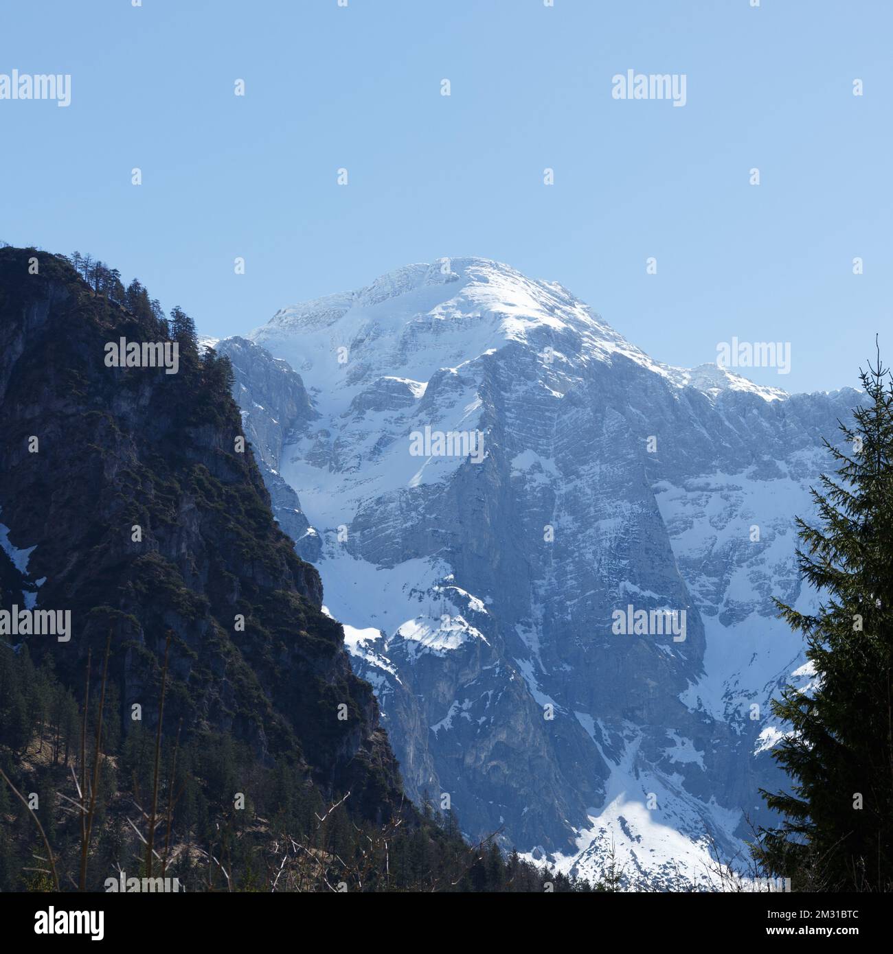 Snowy Mountain Range and Blue Sky in Austria Panorama Stock Photo
