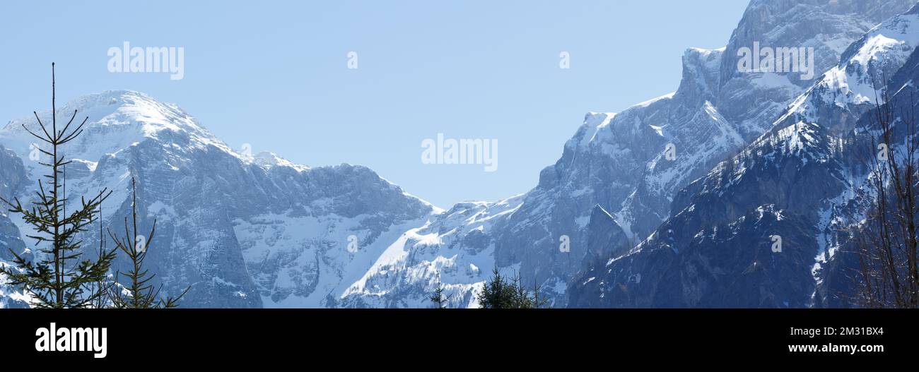Snowy Mountain Range and Blue Sky in Austria Panorama Stock Photo