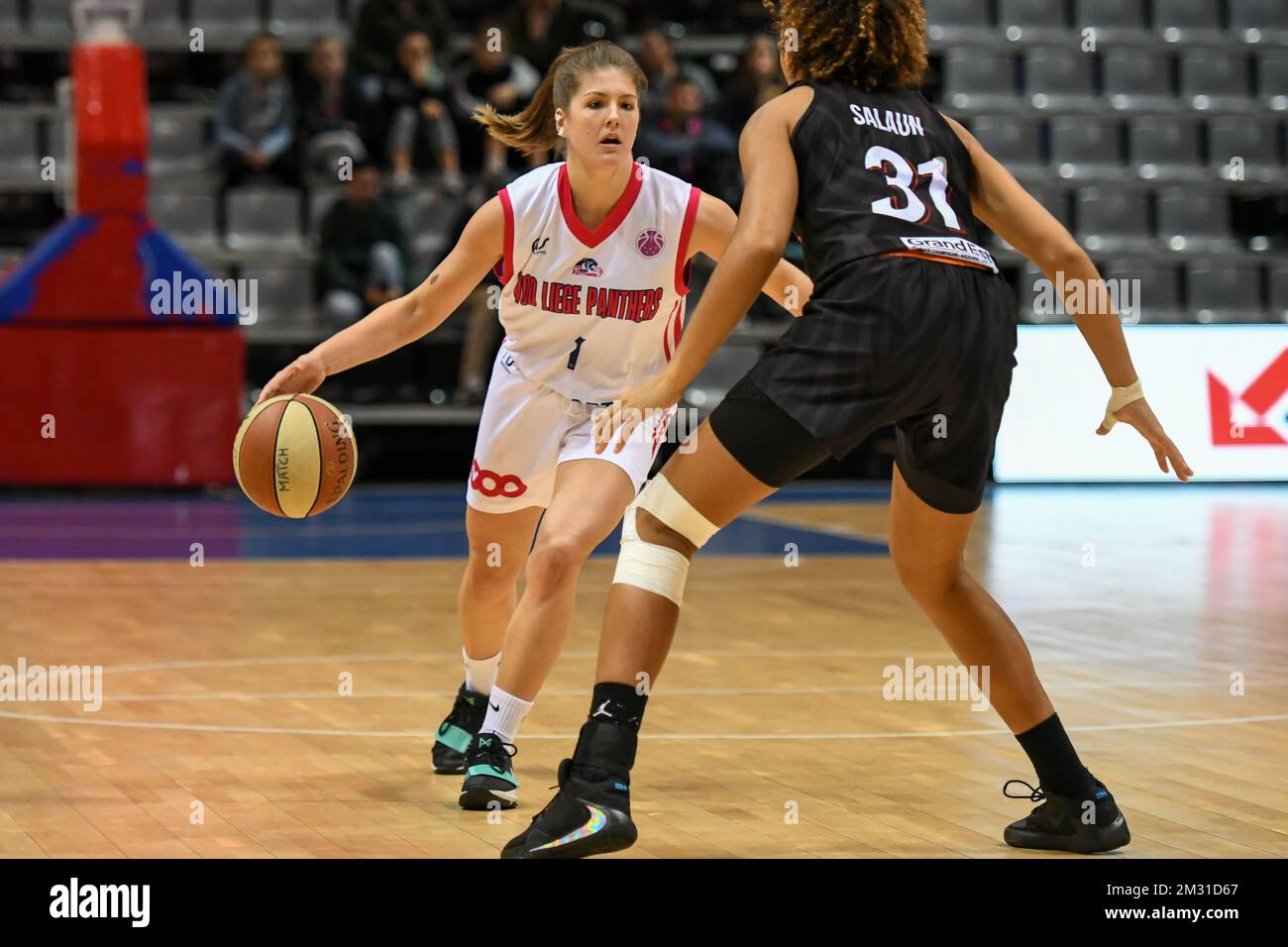 VOO Liege Panthers Eva HAMBURSIN (1) and Flammes Carolo Basket Janelle  Illona SALAUN (31) fight for the ball during a basketball match between VOO  Liege Panthers and Flammes Carolo Basket, on the