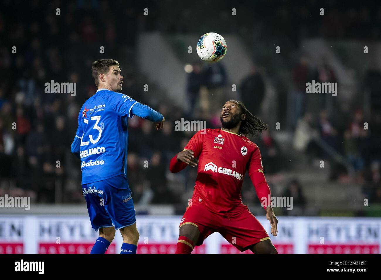 Gent's Mikael Lustig and Antwerp's Dieumerci Mbokani Bezua fight for