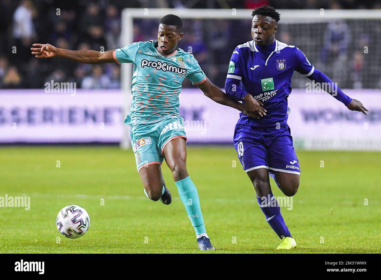 BRUSSELS, BELGIUM - December 08: Jeremy Doku of Anderlecht and Maxime Busi  of Charleroi fight for the ball during the Jupiler Pro League match day 18  between Rsc Anderlecht vs Sporting Charleroi