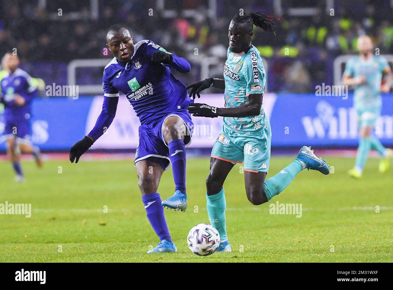 BRUSSELS, BELGIUM - December 08: Jeremy Doku of Anderlecht and Maxime Busi  of Charleroi fight for the ball during the Jupiler Pro League match day 18  between Rsc Anderlecht vs Sporting Charleroi