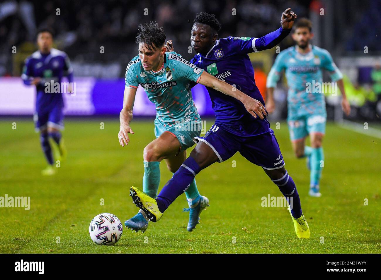 BRUSSELS, BELGIUM - December 08: Jeremy Doku of Anderlecht and Maxime Busi  of Charleroi fight for the ball during the Jupiler Pro League match day 18  between Rsc Anderlecht vs Sporting Charleroi