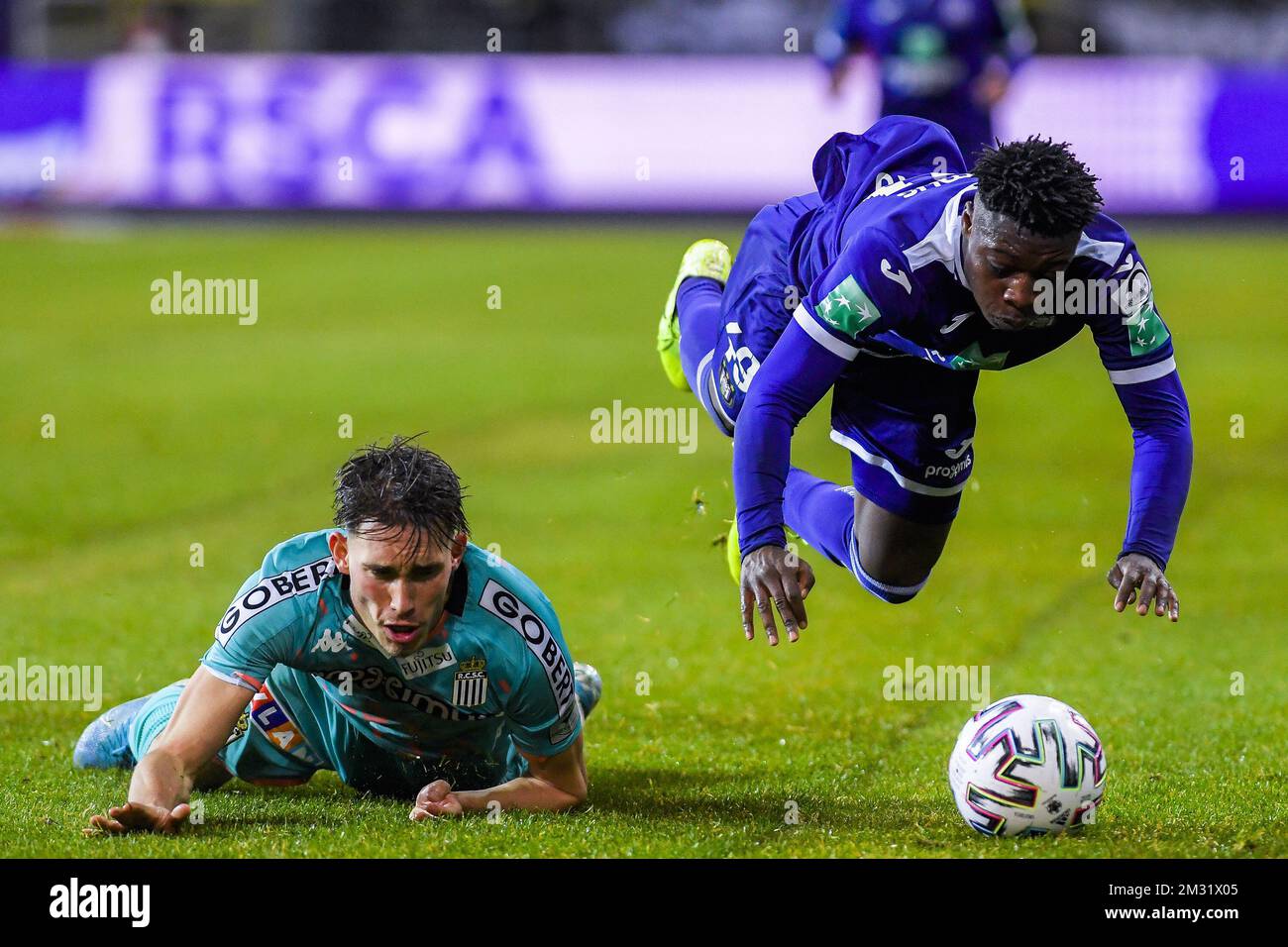 BRUSSELS, BELGIUM - December 08: Jeremy Doku of Anderlecht and Maxime Busi  of Charleroi fight for the ball during the Jupiler Pro League match day 18  between Rsc Anderlecht vs Sporting Charleroi