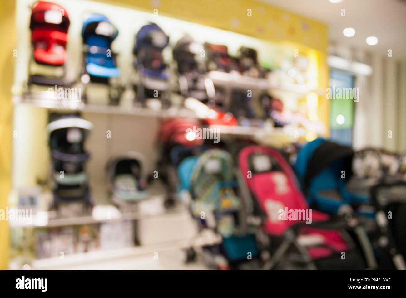 Baby Stroller show in shop department store blur for background Stock