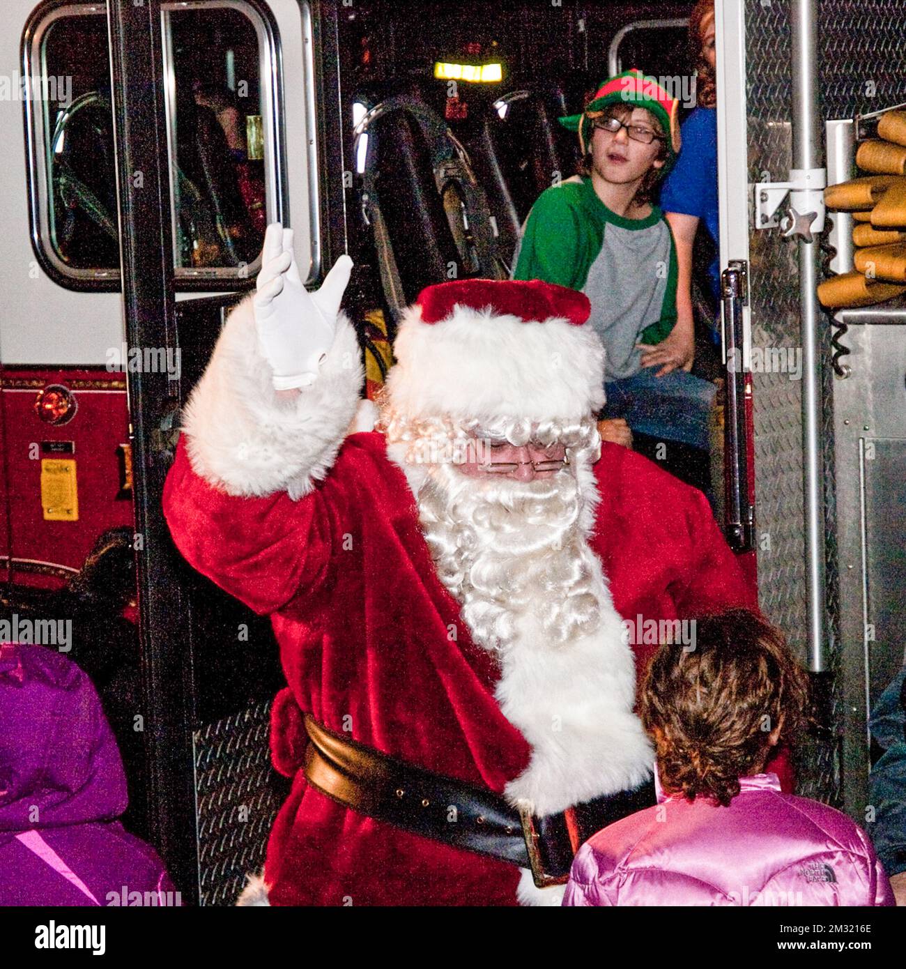 Festive moments a local santa claus visits children at hi-res stock ...