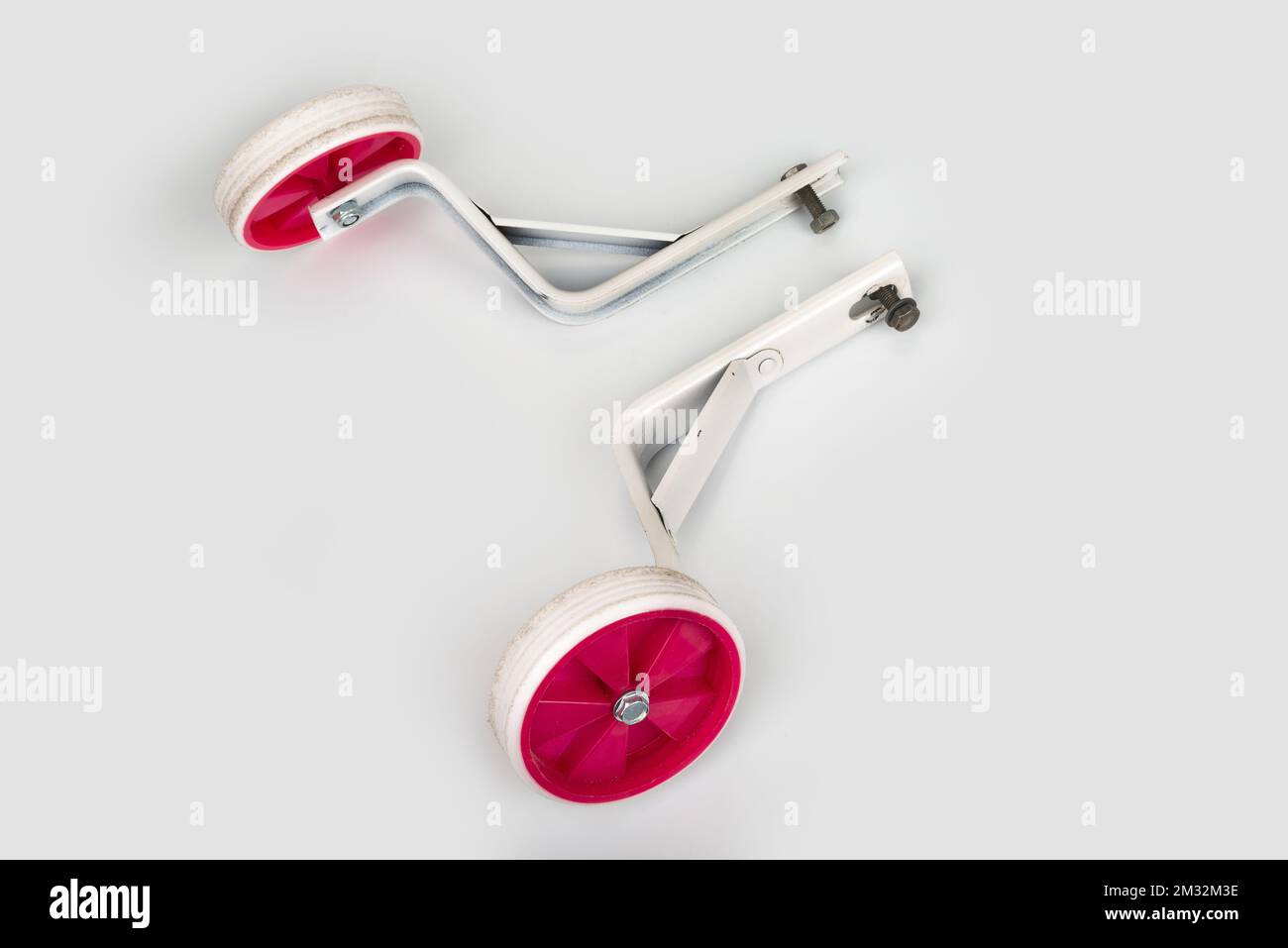 Child bicycle support training wheels on a white Stock Photo - Alamy