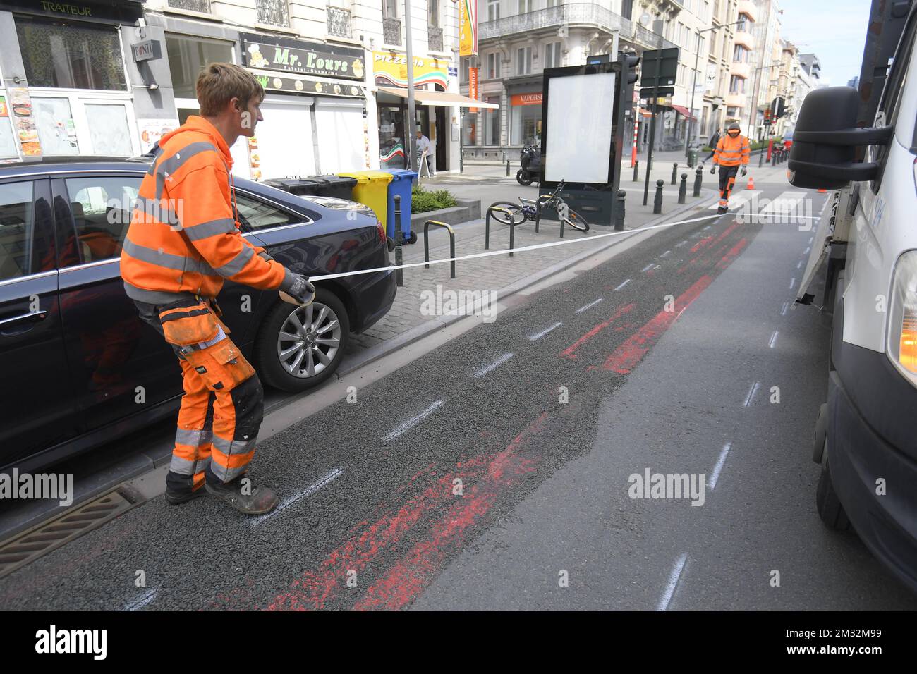 Illustration picture shows the installation of a new bicycle path, at the Boulevard Emile Jacqmain/ Emile Jacqmainlaan in Brussels, Tuesday 05 May 2020. Belgium is in week 8 of confinement in the ongoing corona virus crisis. Phase 1A of the exit plan from the lockdown situation in the country has started this week. BELGA PHOTO LAURIE DIEFFEMBACQ  Stock Photo
