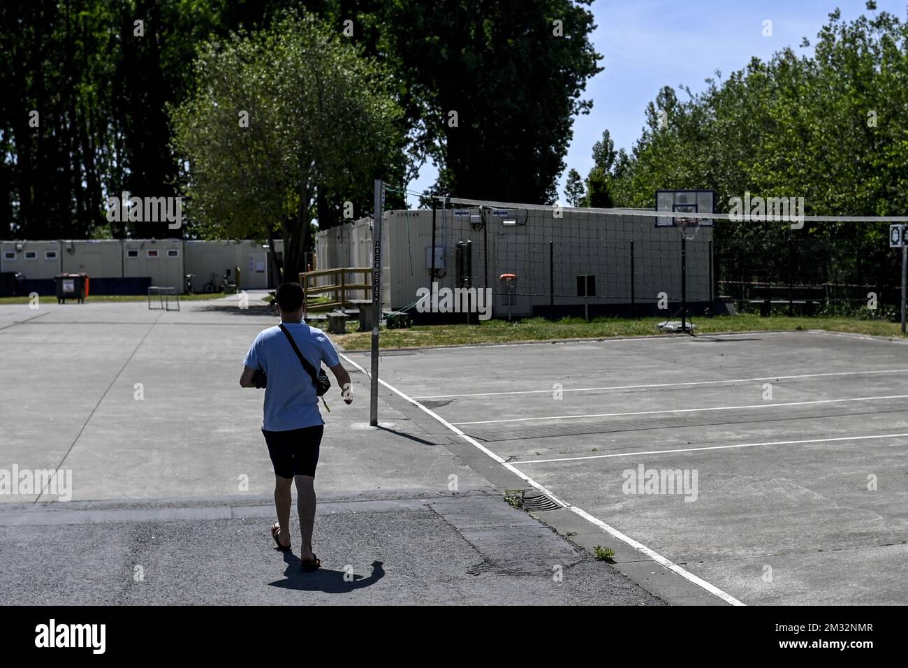 Illustration picture shows a resident at a volleyball field at the Fedasil shelter for refugees in Poelkapelle, Wednesday 27 May 2020. Belgium is in its eleventh week of confinement in the ongoing corona virus crisis and the second week of the phase 2 of the deconfinement. BELGA PHOTO DIRK WAEM Stock Photo