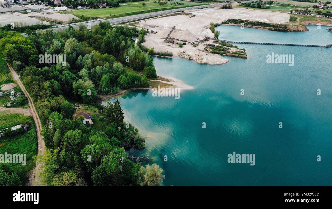 An aerial view of a landscape with lake and trees around Stock Photo ...