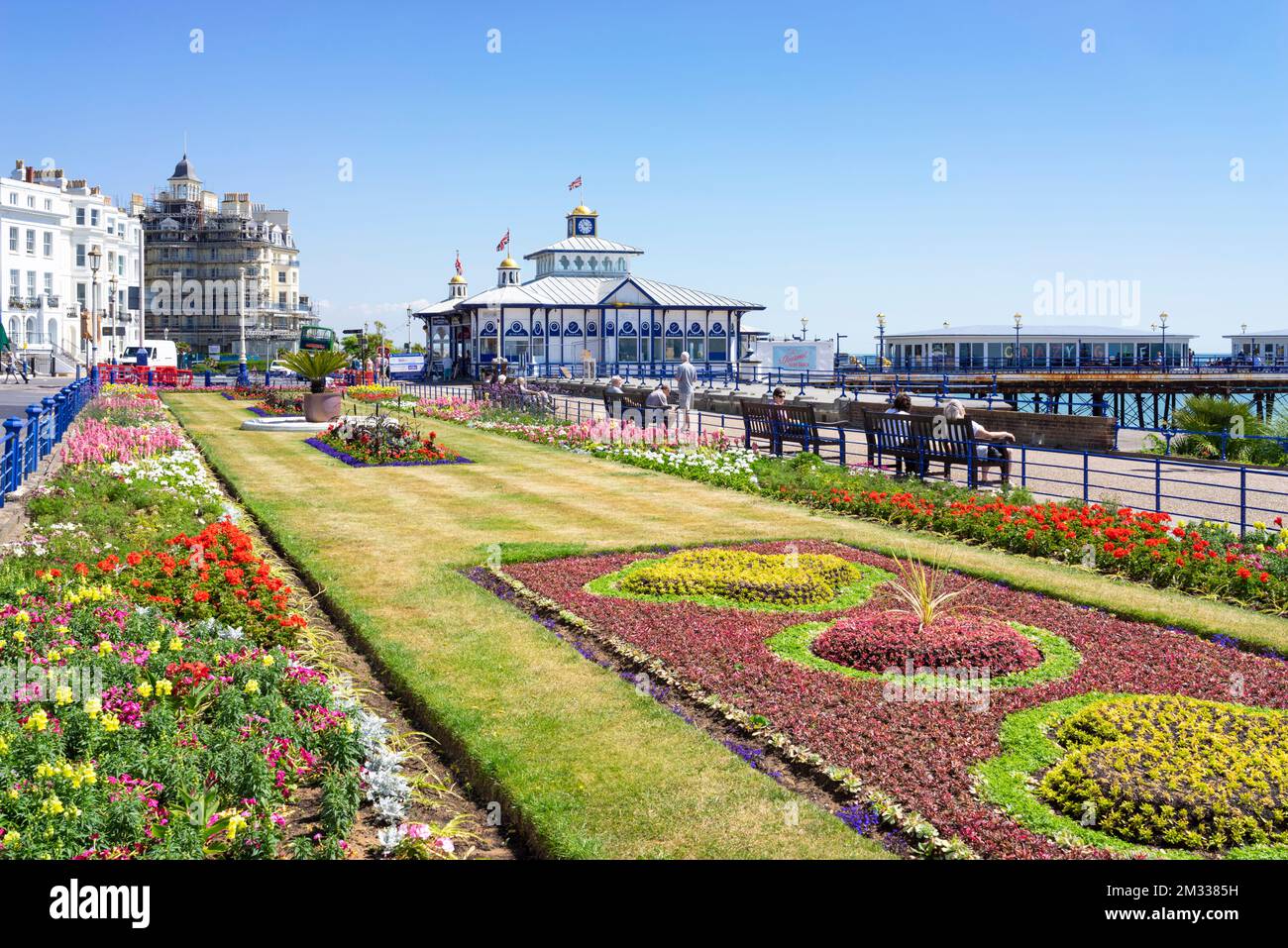 Eastbourne East Sussex the flower filled Carpet gardens on the seafront promenade and Eastbourne Pier Eastbourne East Sussex England GB UK Europe Stock Photo