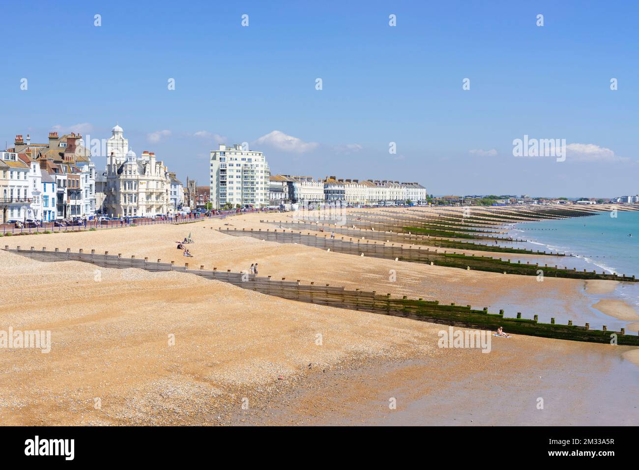 Eastbourne East Sussex Eastbourne shingle beach with wooden groynes and promenade with large hotels Eastbourne East Sussex England UK GB Europe Stock Photo