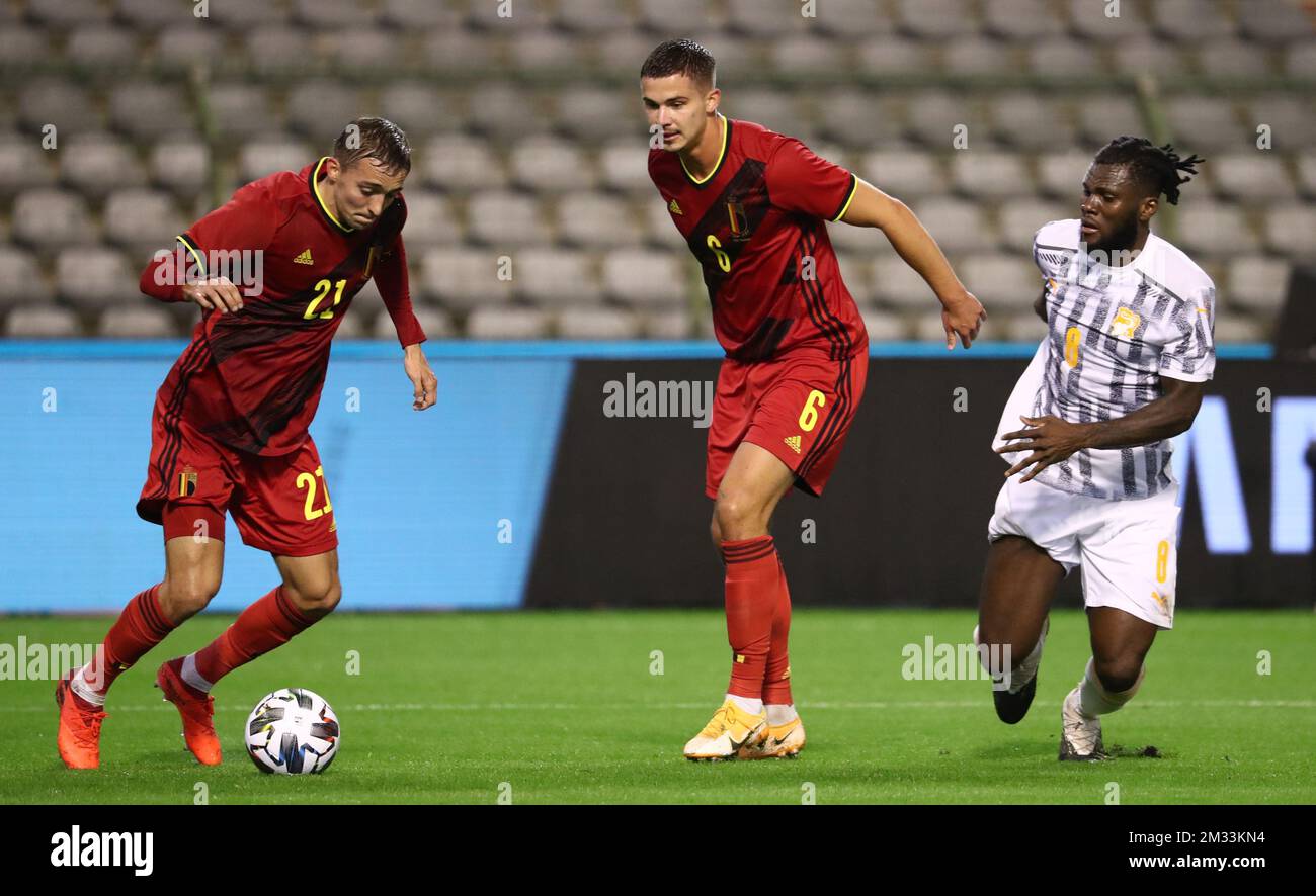 Belgium's Timothy Castagne, Belgium's Leander Dendoncker and Ivory Coast Franck Kessie fight for the ball during a friendly game between the Belgian national soccer team Red Devils and Ivory Coast, Thursday 08 October 2020 in Brussels. BELGA PHOTO VIRGINIE LEFOUR Stock Photo