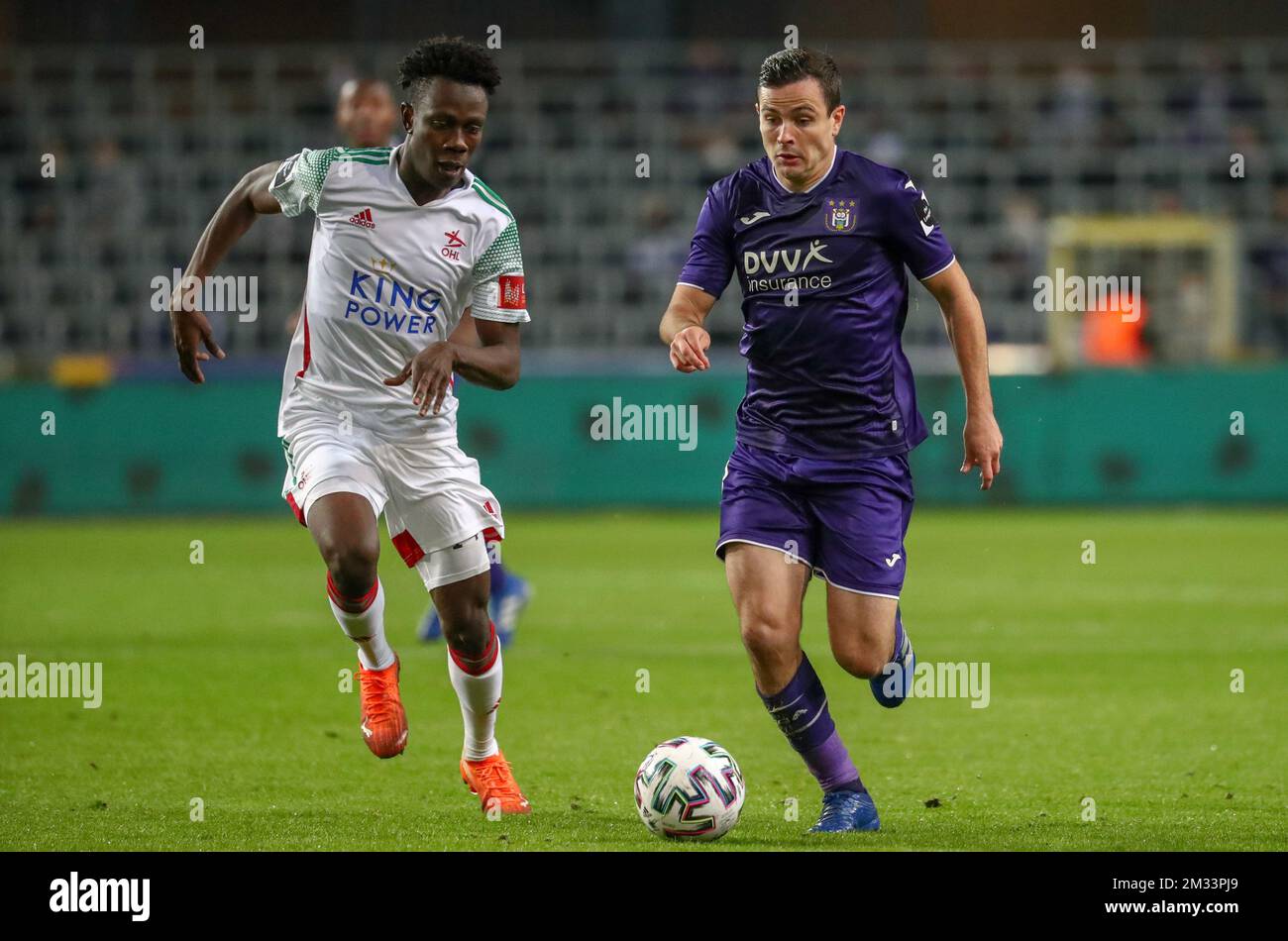 Anderlecht's Francis Amuzu and OHL's Kamal Sowah fight for the