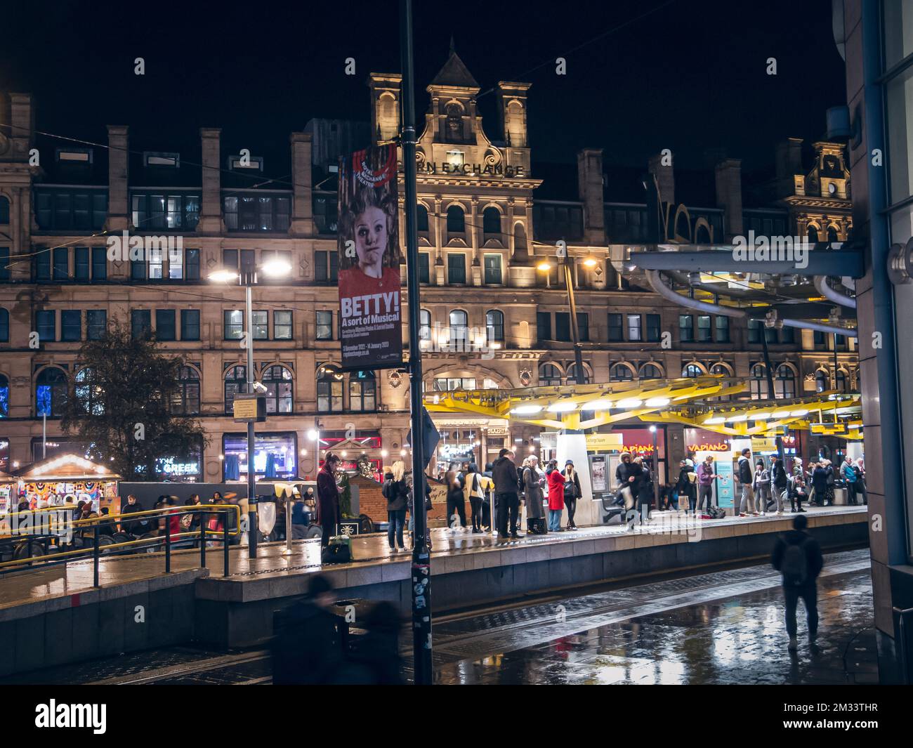 Tram in Shambles Square in Manchester at night Stock Photo - Alamy