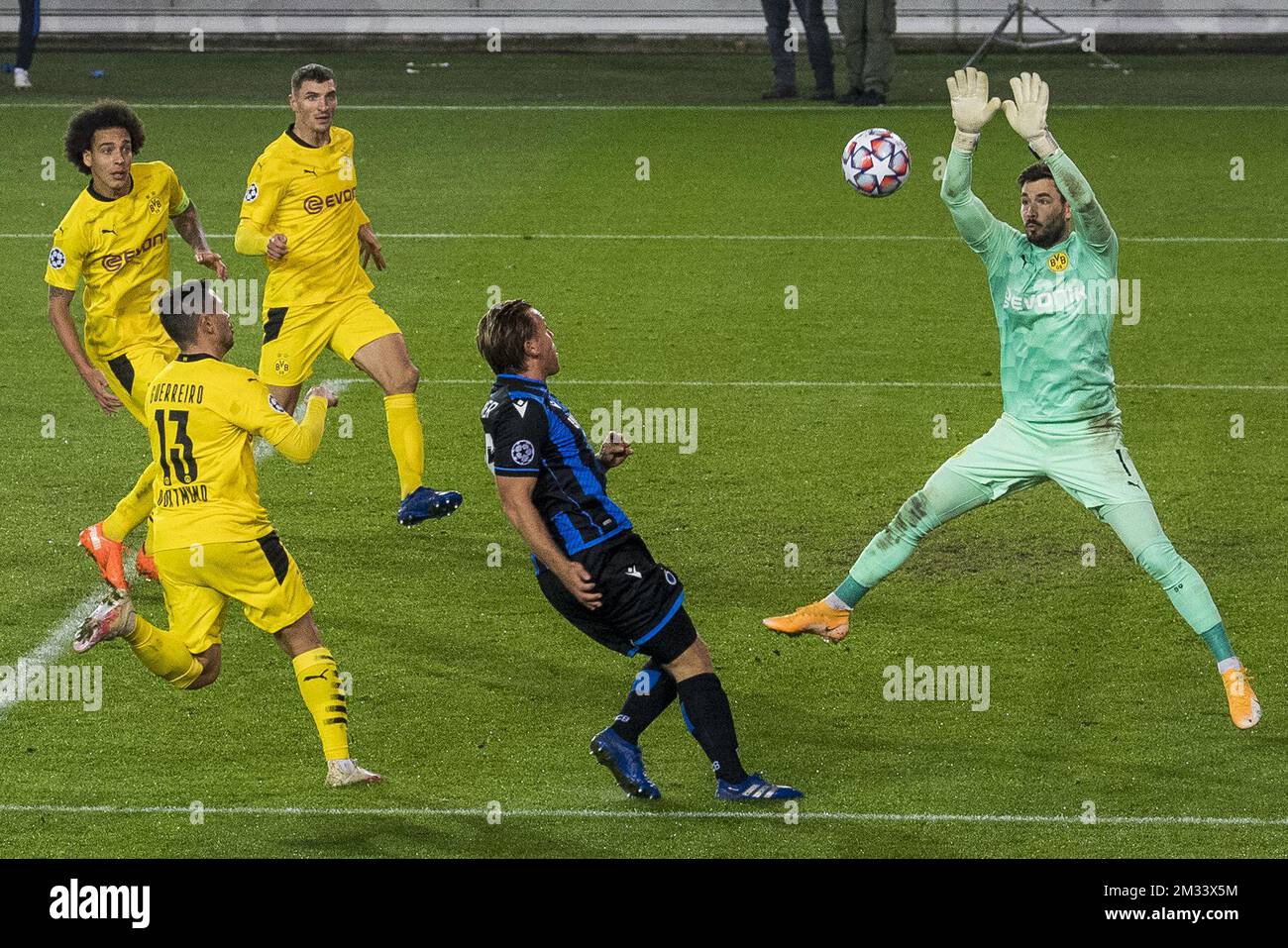 Dortmund's Raphael Guerreiro, Club's Ruud Vormer and Dortmund's goalkeeper Roman Burki fight for the ball during a soccer game between Belgian Club Brugge KV and German Ballspielverein Borussia 09 e.V. Dortmund, Wednesday 04 November 2020 in Brugge, the third group stage game of the UEFA Champions League, in group F. BELGA PHOTO JASPER JACOBS Stock Photo