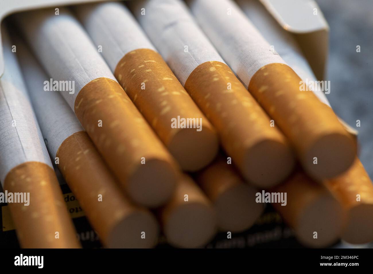 combustible cigarettes meaning HEETS tobacco sticks packet (left) and combustible cigarette packet