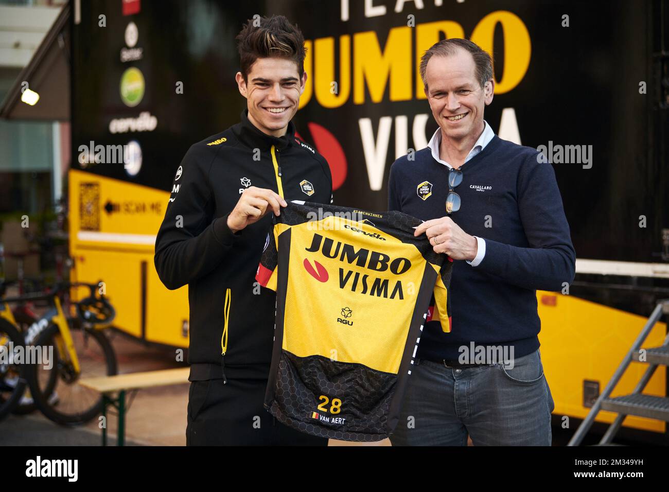 This handout picture shows Belgian Wout Van Aert of Team Jumbo-Visma and Team Jumbo-Visma general manager Richard Plugge posing for the photographer after announcing Van Aert will renew his contract, at the Team Jumbo-Visma cycling team stage in Alicante, in Spain, Tuesday 19 January 2021. BELGA PHOTO HANDOUT JUMBO-VISMA - BRAM BERKIEN  Stock Photo