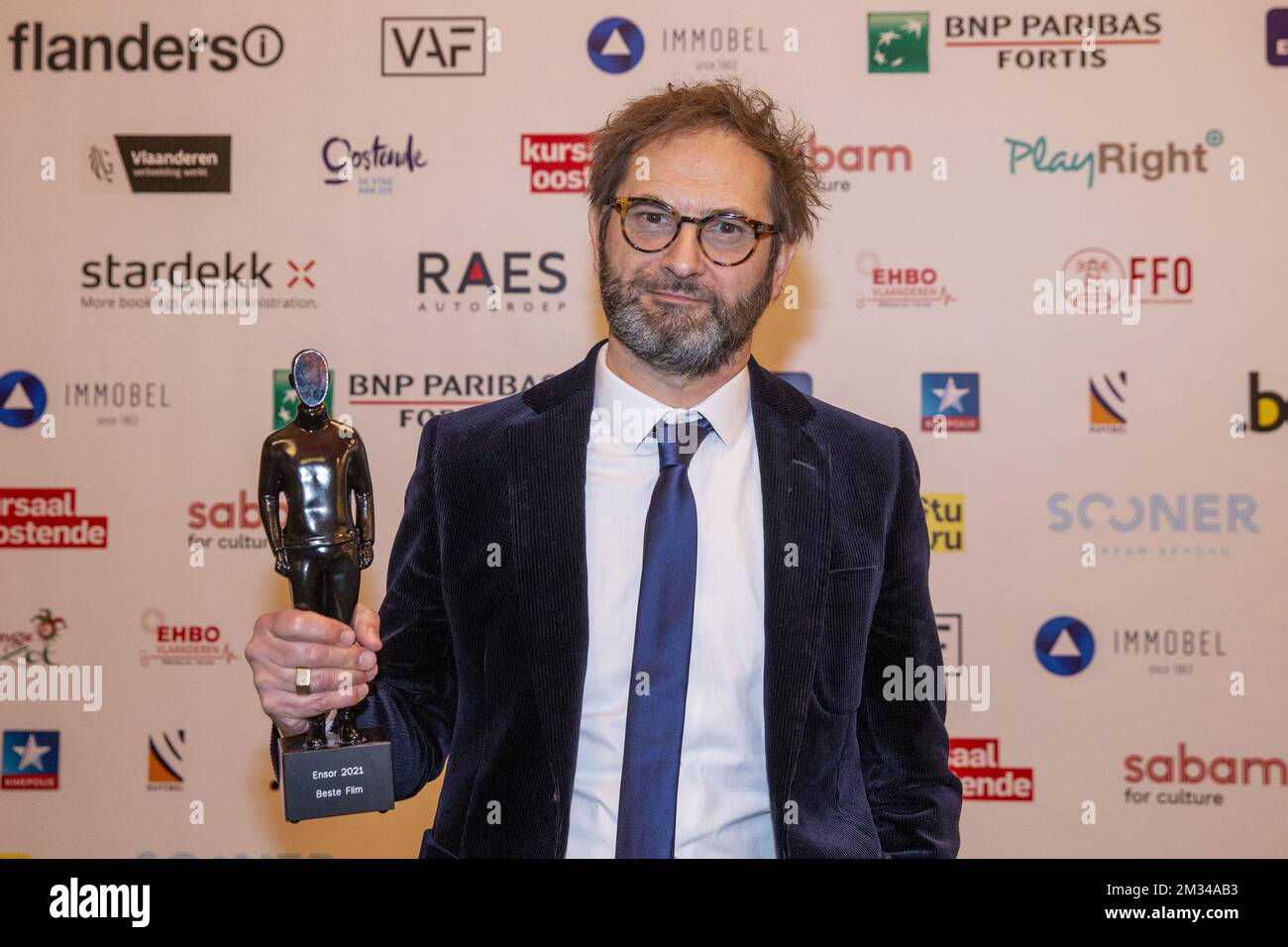 Bart Van Langendonck poses for the photographer with the Best Film Award at the award ceremony of the Ensors Flemish film prizes during the FFO Nights 2021 of the Oostende Film Festival, Saturday 23 January 2021, in Oostende. BELGA PHOTO NICOLAS MAETERLINCK Stock Photo
