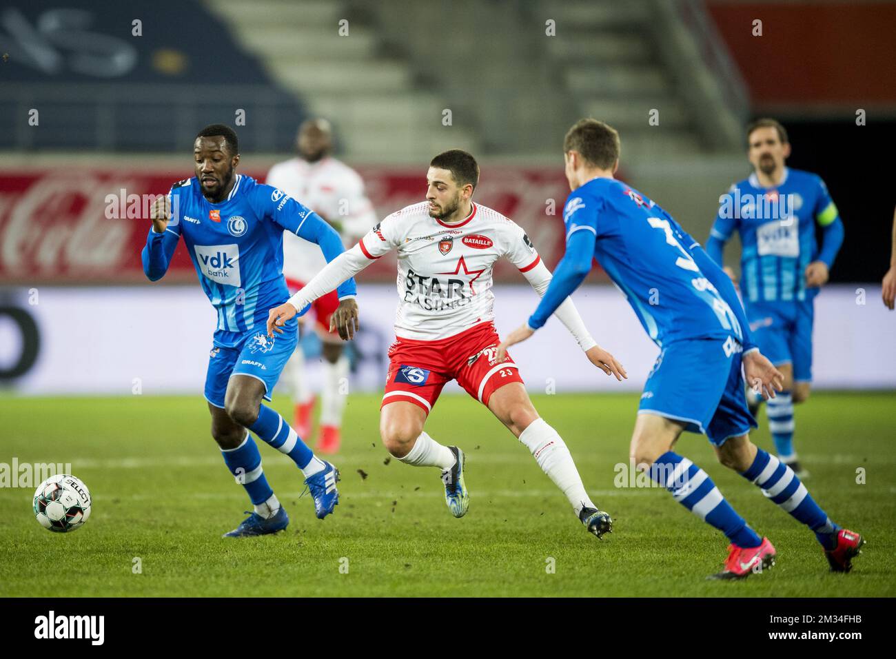 Gent's Elisha Owusu and Mouscron's Bruno Xadas Alexandre Vieira Almeida fight for the ball during a soccer match between KAA Gent and Royal Excel Mouscron, Monday 15 February 2021 in Gent, on day 26 of the 'Jupiler Pro League' first division of the Belgian championship. BELGA PHOTO JASPER JACOBS Stock Photo